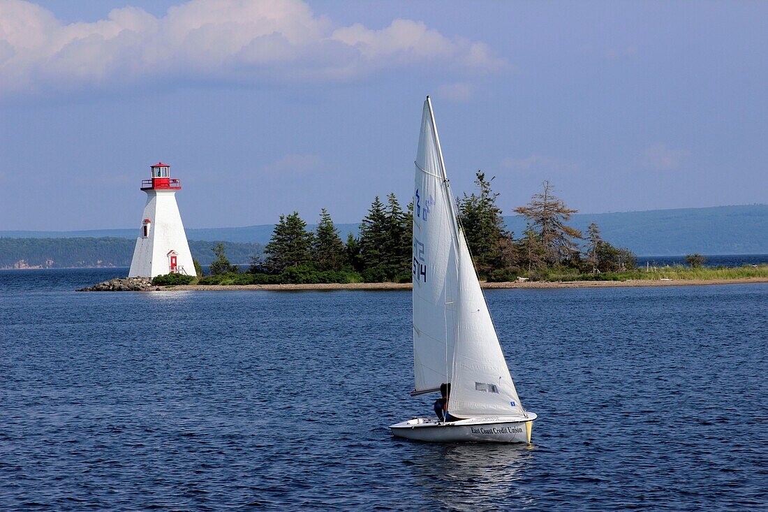 Canada, Nova Scotia, Cape Breton, Baddeck, Bras d´Or Lake, lighthouse, with sloop, sail boat.