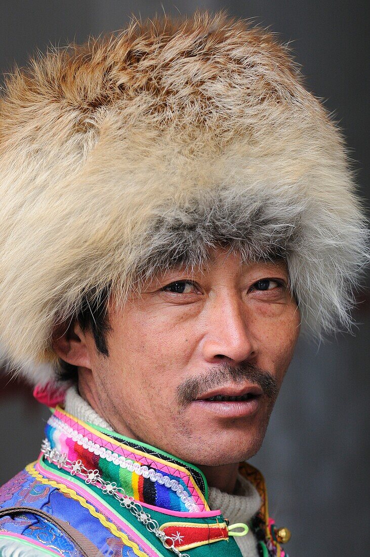 China, Sichuan, Kham, Danba, Khampa wearing a fur cap