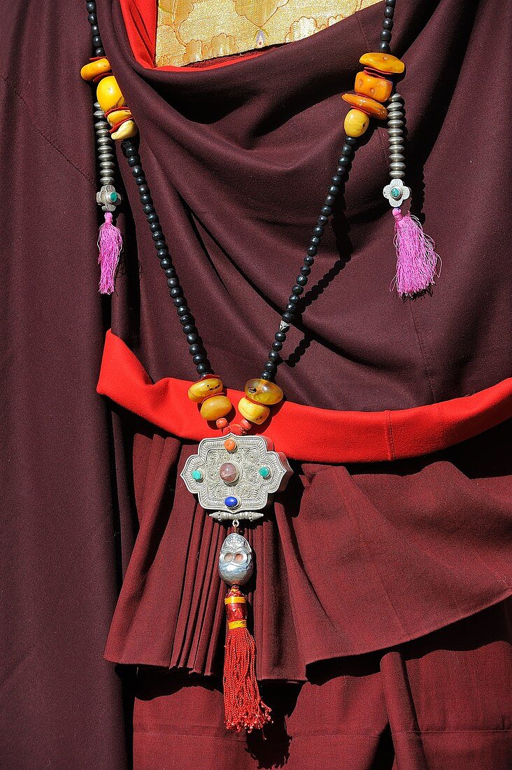 China, Gansu, Amdo, Xiahe, Monastery of Labrang Labuleng Si, Losar New Year festival, Monk´s traditional dress and jewellery