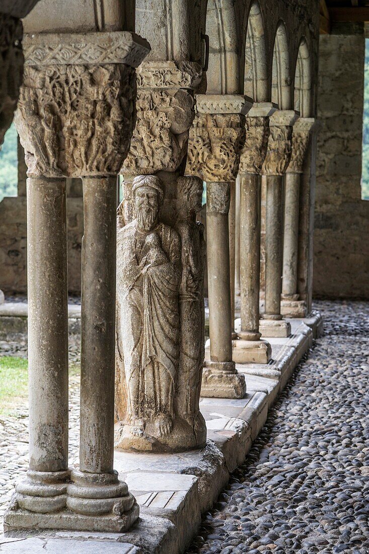 Column depicting Evangelists in western gallery of cloister of Cathedral Notre-Dame de Saint-Bertrand-de-Comminges. Hautes-Pyrénées, France.