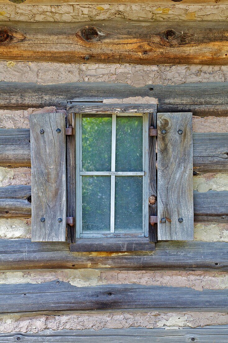 Rustic Window of a Log Cabin with Handmade Wood Shutters