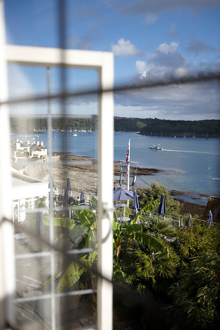 View from hotel room over a bed of banana trees towards the harbour of St. Mawes, Hotel Tresanton, St. Mawes, Cornwall, Great Britain