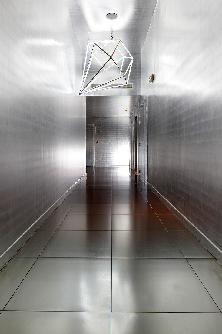 Silver hallway with walls covered in aluminium, Hotel La Maison Champs-Elysees, designed by Martin Margiela, Paris, France