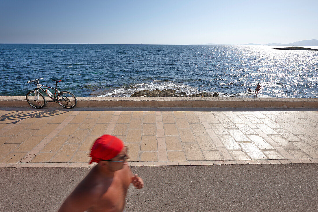 Bicycle lane on the esplanade at club and restaurant Puro Beach, Can Pastilla, Badia de Palma, Mallorca, Balearic Islands, Spain