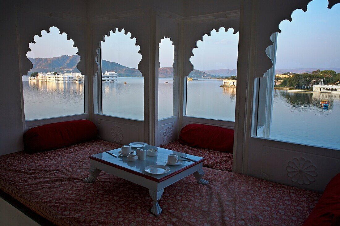 On the left the Lake Palace Hotel, Lake Pichola  Udaipur  Rajasthan  India.