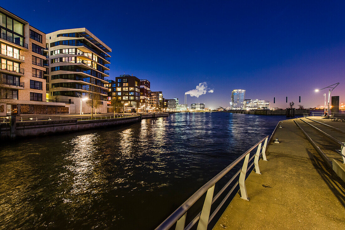 Modern architecture in the twilight, Am Kaiserkai, with view to the Grasbrook harbour and Marco-Polo-Tower, HafenCity, Hamburg, Germany