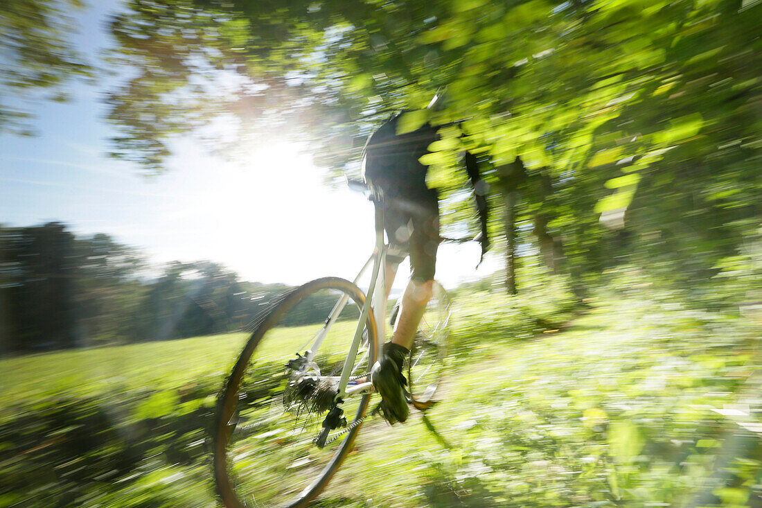 Man cyclocross touring in autumn, Oberambach, Munsing, Bavaria, Germany