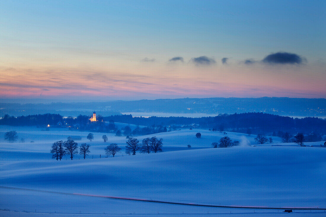 View to Holzhausen with parish church of St. John the Baptist in twilight, Holzhausen, Munsing, Bavaria, Germany