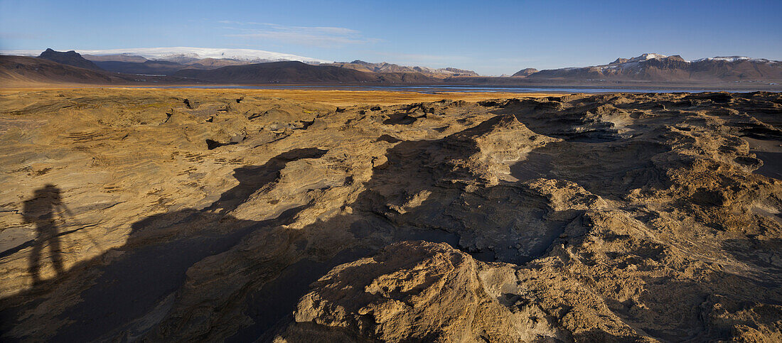Shadow of a photographer, sandstone formations, Dyrholaos, Myrdalsjokull, South Iceland, Iceland