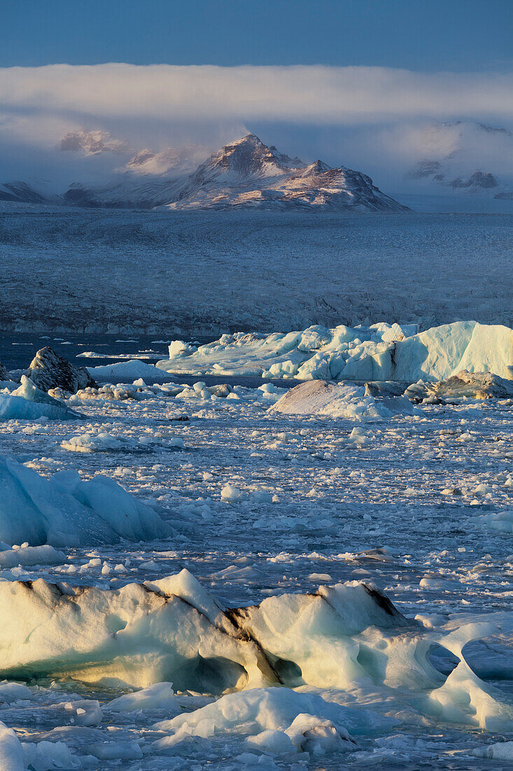 Icebergs in the waves in the glacial lake, Jokulsarlon, East Iceland, Iceland