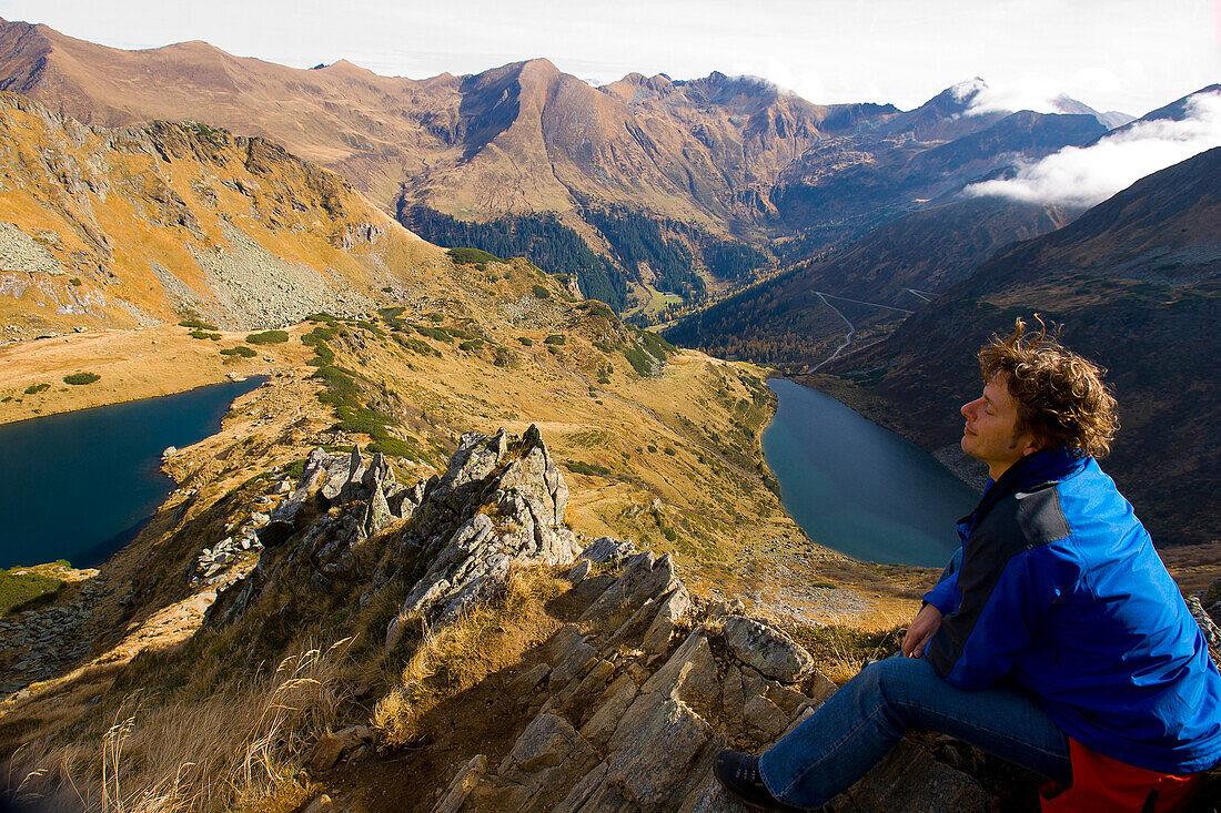 Hiker resting on a rock, Schladminger Tauern, Styria, Austria