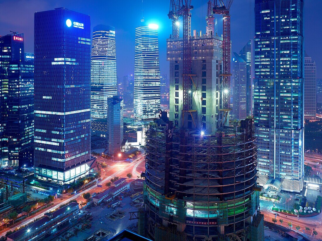 The construction of the Shanghai Tower in Shanghai, China next to the Shanghai World Financial Center and the Jin Mao Tower