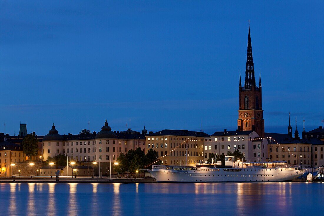 Riddarfjärden with Klara Church and ship at night, Stockholm, Sweden