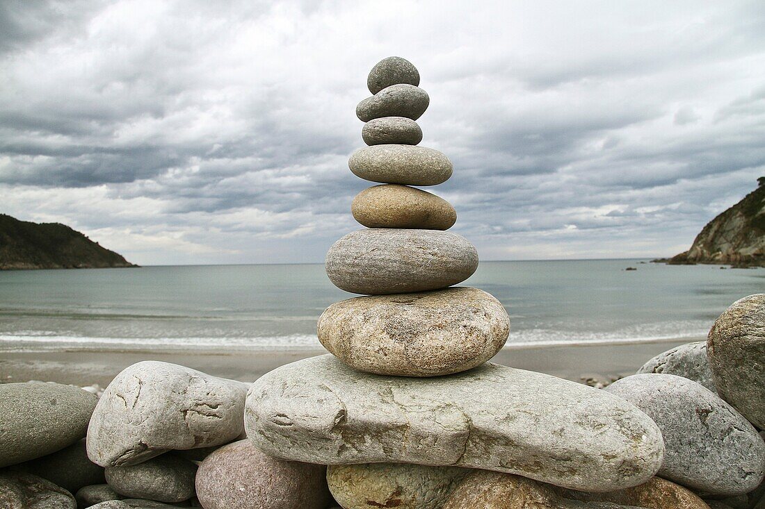 Stone cairn in La Concha de Artedo beach, Cudillero, Asturias, Spain