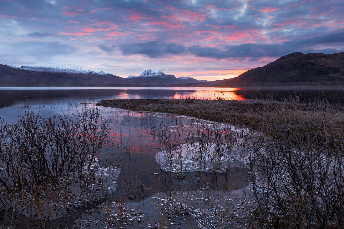 Sunrise above the Northwest Highlands with the wide view over Loch Maree in winter, Scotland, United Kingdom