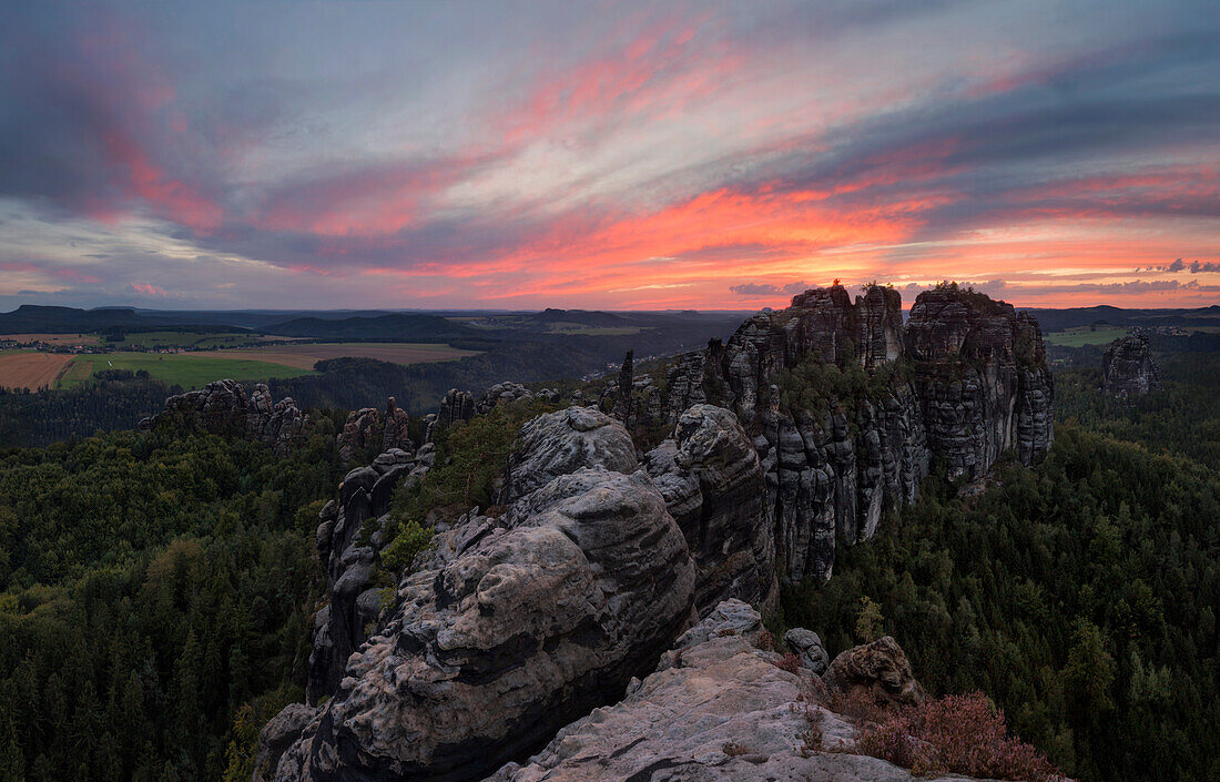 Sunset above the impressive rock formation Schrammsteine in Saxony Switzerland national park, Saxony, Germany