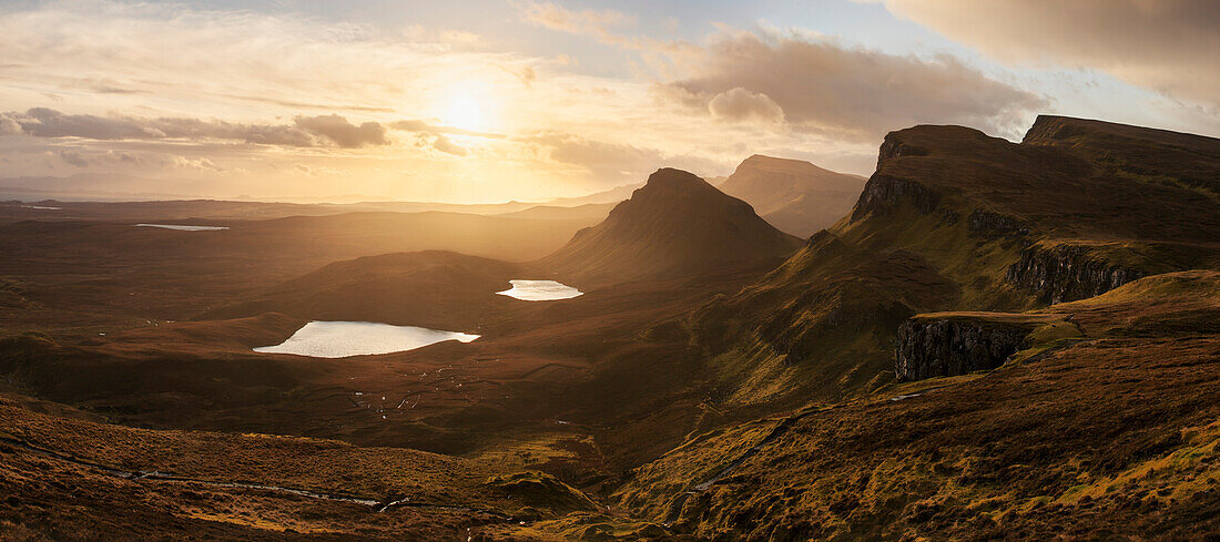 Sunrise above the Trotternish peninsula with a wide view to the hills of Quiraing at the northern end of the Isle of Skye, Scotland, United Kingdom