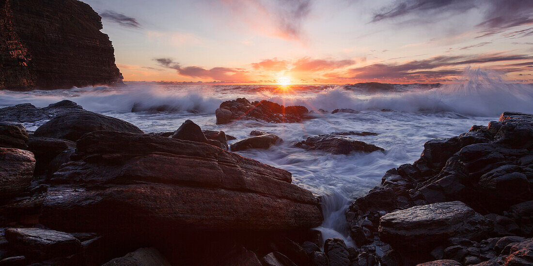 Impressive sunrise on the wild coast of Duncansby Head on the Northeastern coast of Scotland, United Kingdom