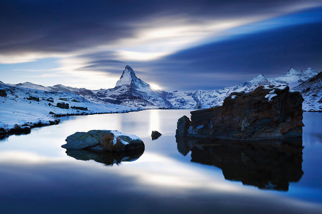 Twilight above the snow-covered landscape around Lake Stelli with the view towards the Matterhorn in autumn, Zermatt, Valais, Switzerland