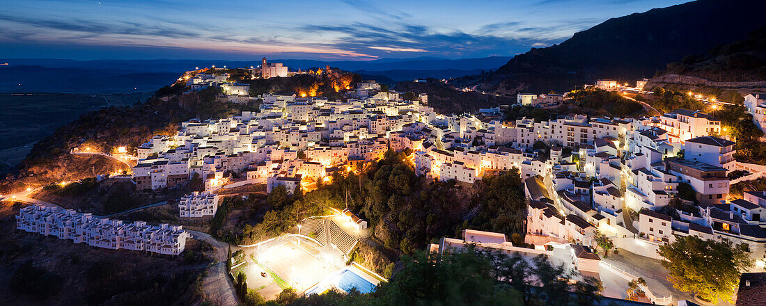 The Andalusian village Casares with typical white houses that nestle against the mountain hillside, Andalusia, Spain