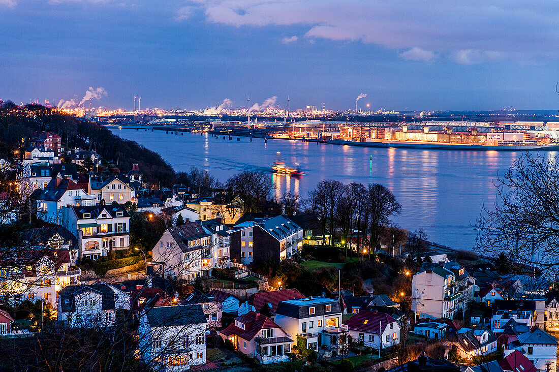 Twilight over Blankenese Treppenviertel with the river Elbe and airbus factory in the background, Hamburg, Germany