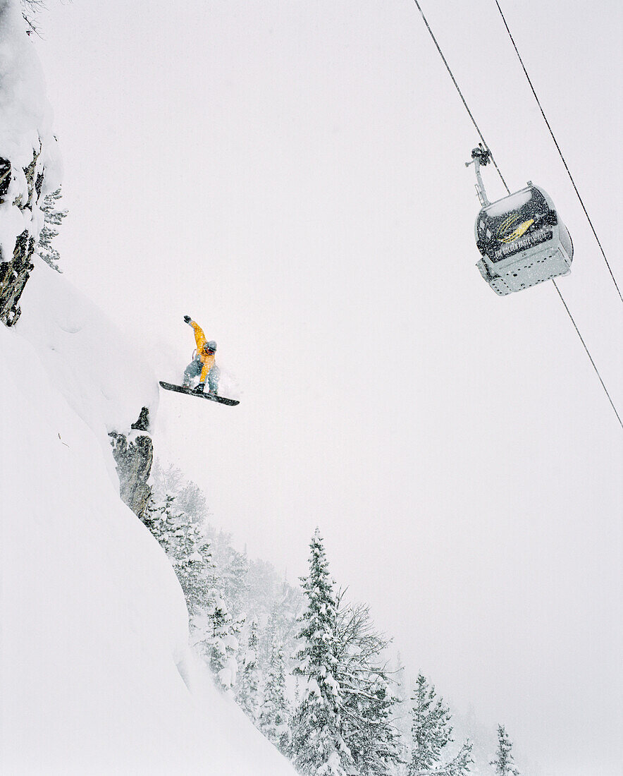 CANADA, snowboarder getting air, Kicking Horse Alpine Resort