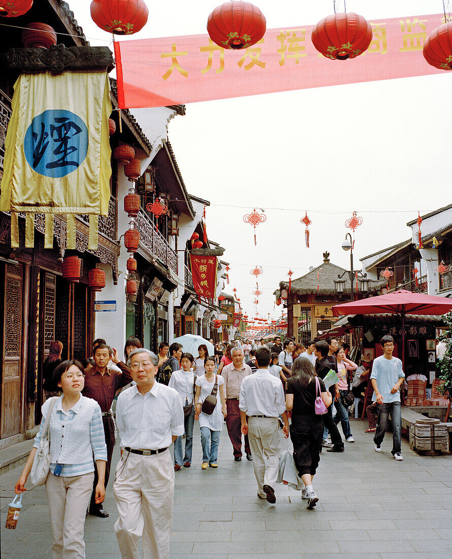 CHINA, Hangzhou, people walking on Hefang Lu street