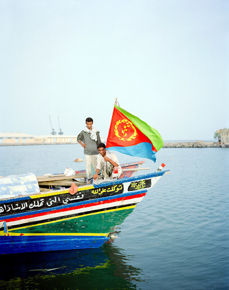 ERITREA, Assab, Yemenese fishermen on the front of their boat in the Port of Assab , Red Sea