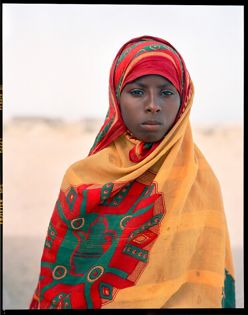 ERITREA, Village of Saroita, portrait of an Afar girl outside of her home