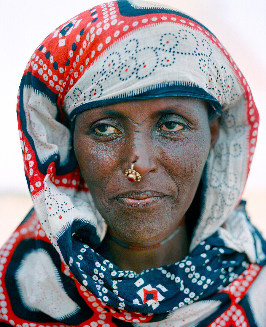ERITREA, Saroita, portrait of an Afar woman in front of her home in the small village of Saroita