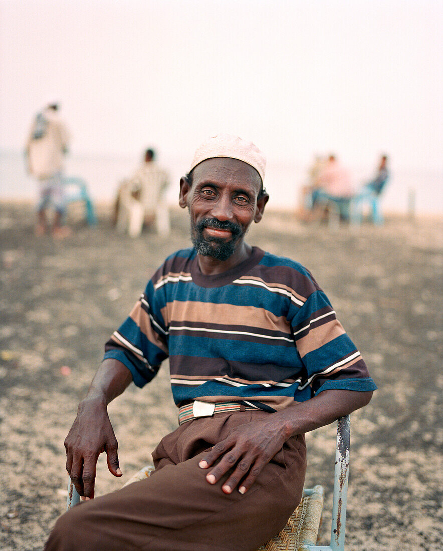 ERITREA, Massawa, Abdullah waits for his coffee at an outdoor café by the Port of Massawa