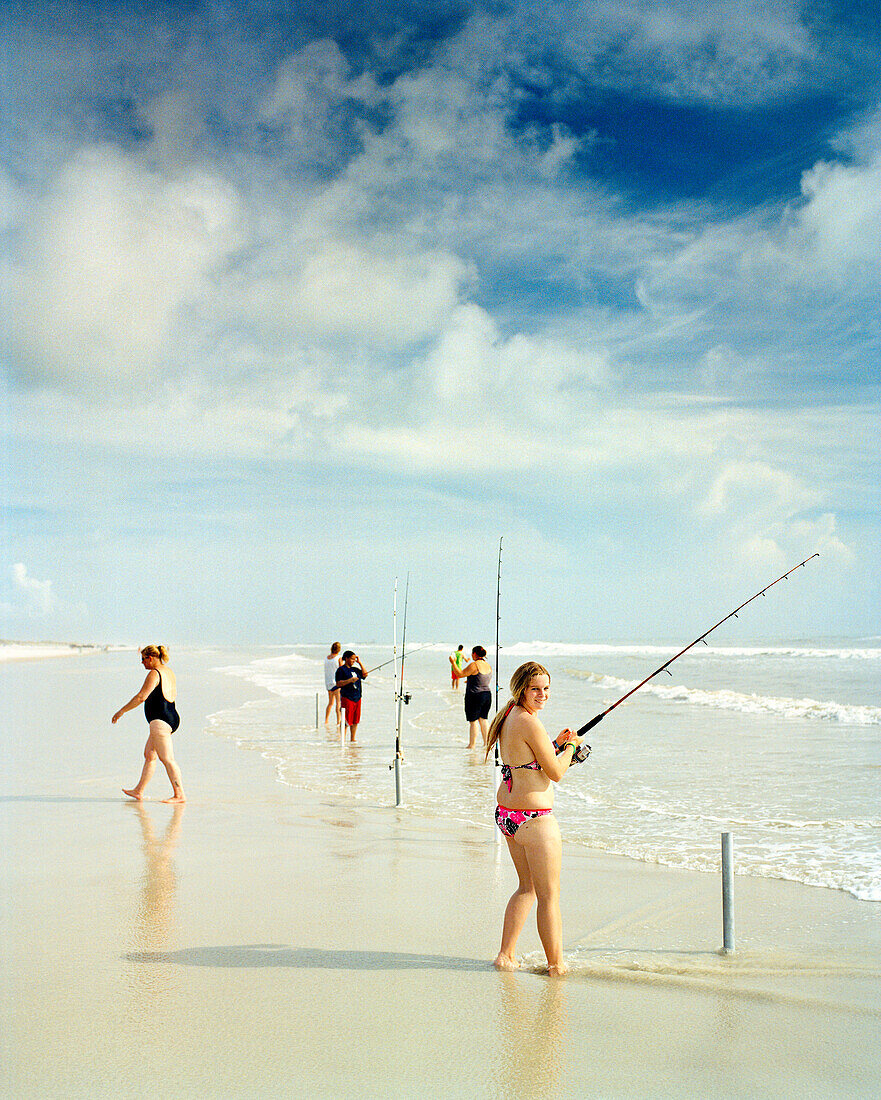 USA, Florida, women fishing on beach, New Smyrna Beach