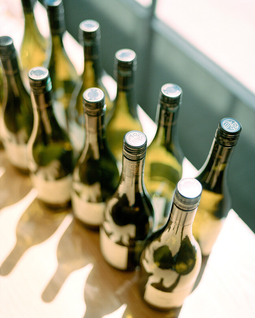 FRANCE, Chablis, Burgundy, wine bottles in a window, elevated view, Laroche Restaurant