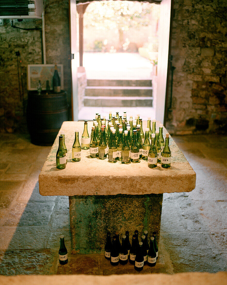 FRANCE, Burgundy, wine bottles in tasting room, Laroche Restaurant, Chablis
