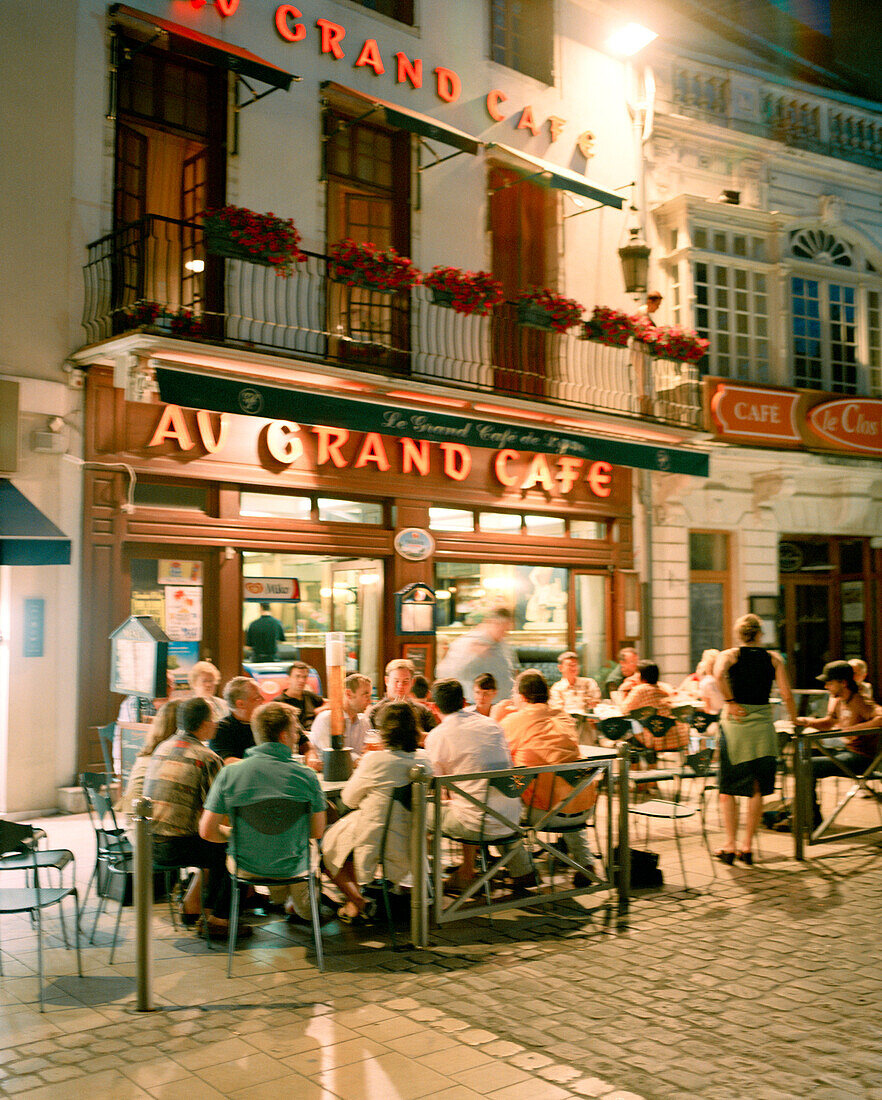 FRANCE, Burgundy, people sitting at outdoor cafe at night, Beaune