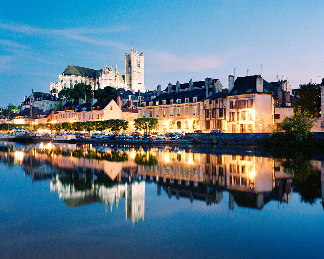 FRANCE, Burgundy, Abaye Saint Germain reflecting on river at night, Auxerre