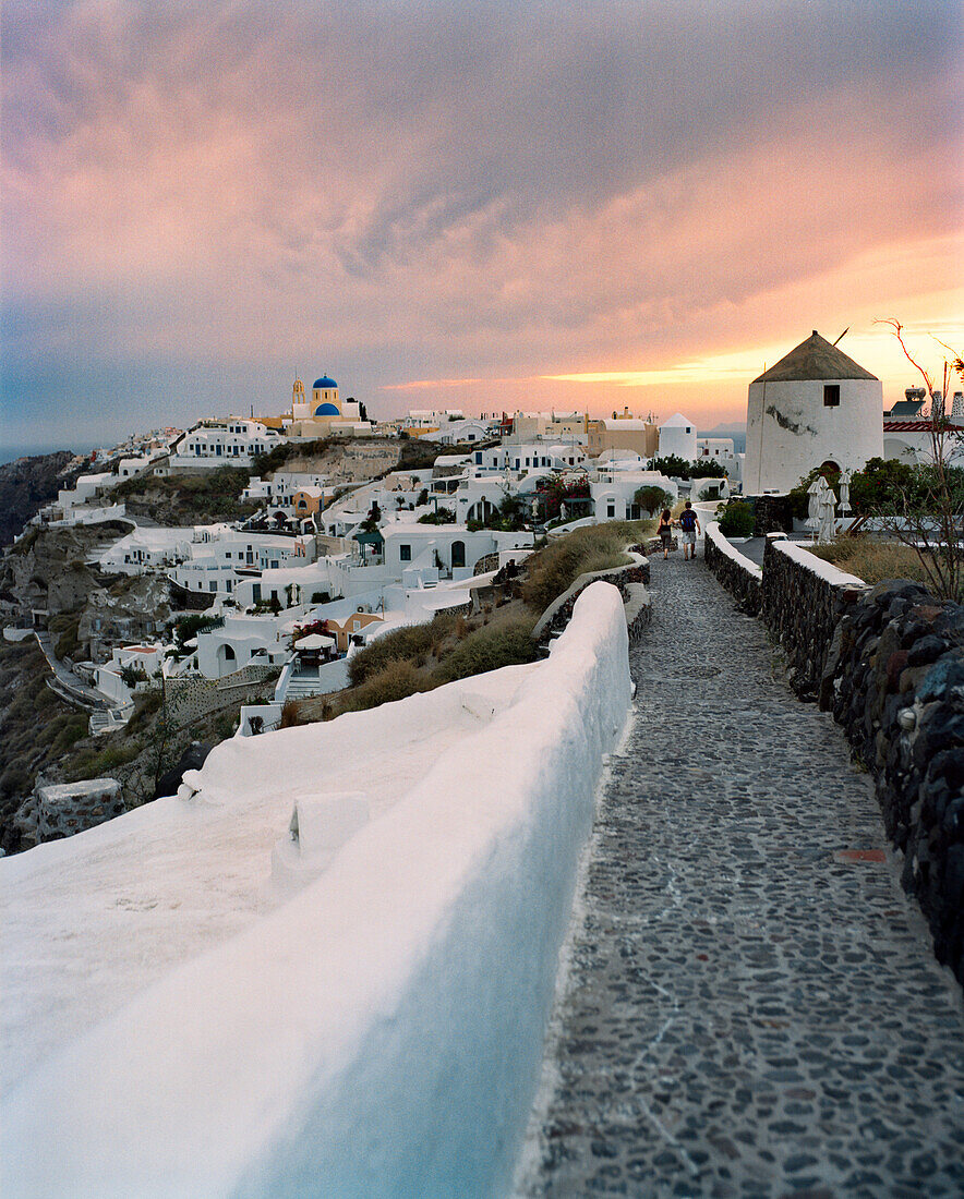 GREECE, Santorini, Oia, homes, restaurants and villas cover the top of the cliffs of Oia, the Mediterranean Sea