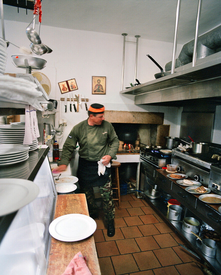 GREECE, Patmos, Skala, Dodecanese Island, chef Benetos in the kitchen of his restaurant, Benetos Restaurant