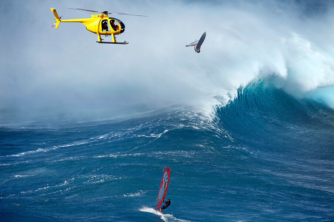 USA, Hawaii, Maui, a man windsurfs and gets big air on a wave at a break called Jaws or Peahi