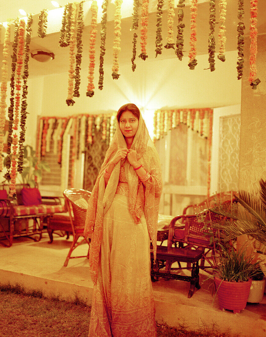 INDIA, New Delhi, portrait of young woman at a wedding, New Delhi