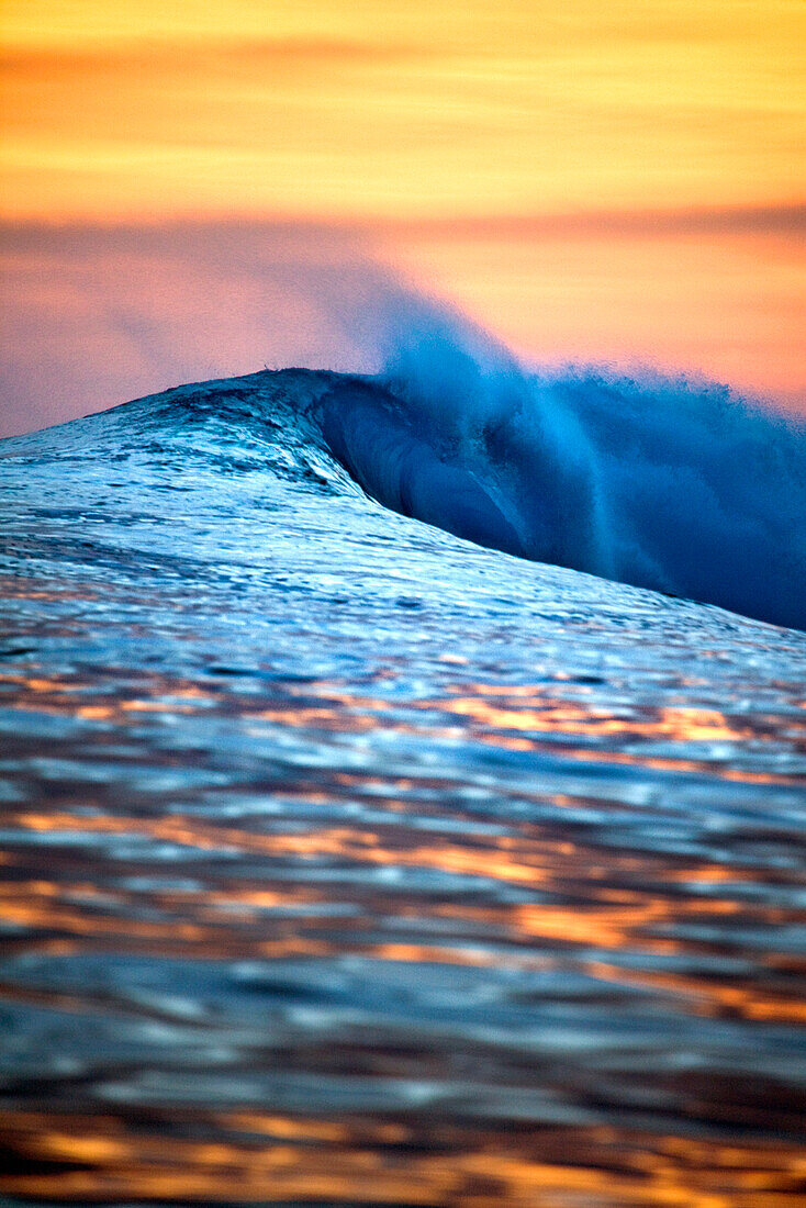 INDONESIA, Mentawai Islands, Kandui Resort, wave in Indian Ocean at sunset