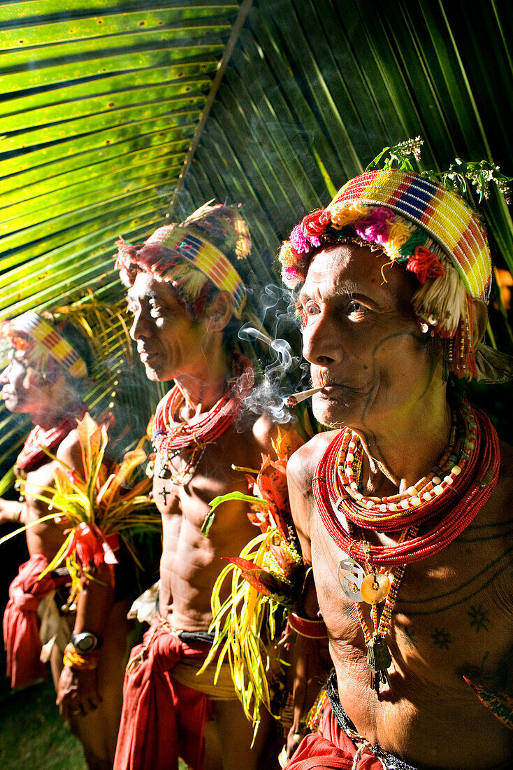 INDONESIA, Mentawai Islands, Kandui Resort, three tribal elders in traditional clothing