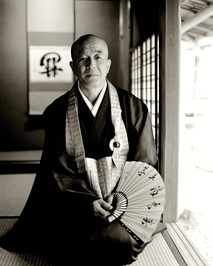 JAPAN, Kyushu, portrait of Hizhidea-Machi holding Japanese fan (B&W)