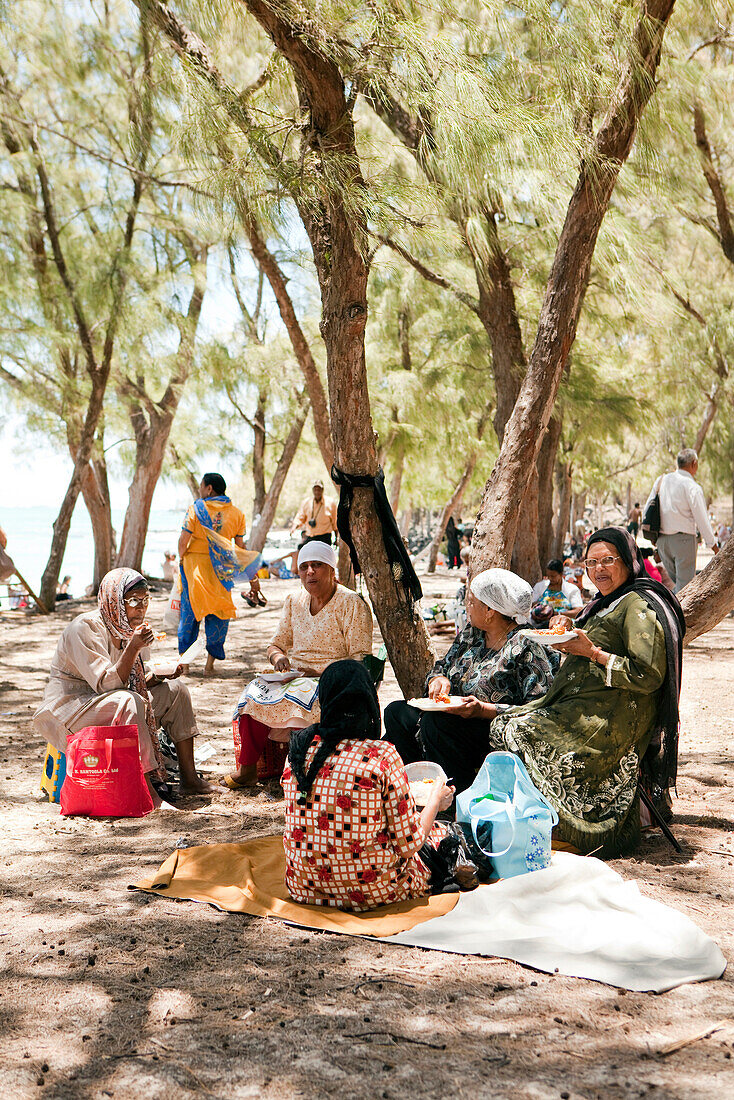 MAURITIUS, Muslim friends are having a picnic on the beach at Ile Aux Cerfs Island