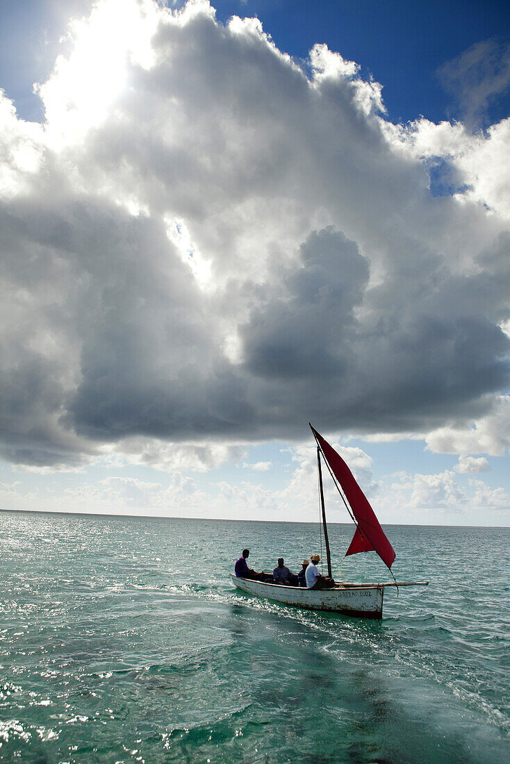 MAURITIUS, Trou D'eau Deuce, sailors on the East coast of Mauritius with the Indian Ocean behind them