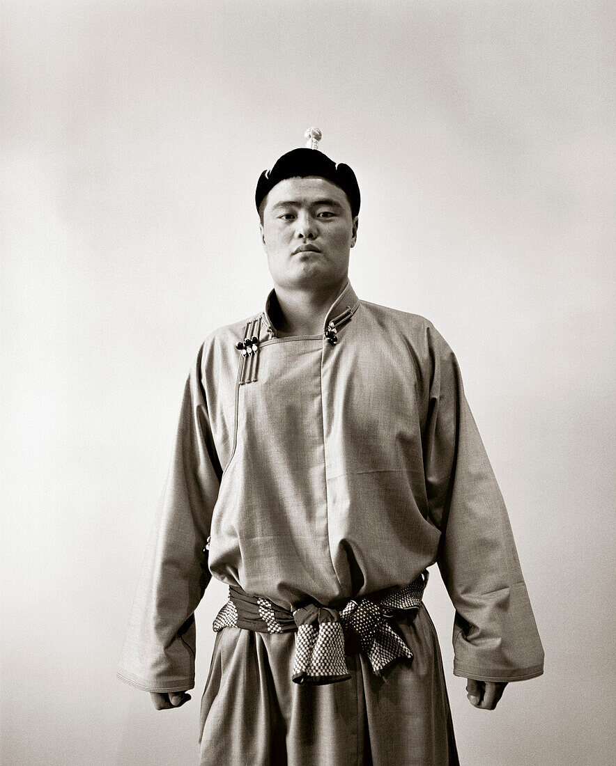 MONGOLIA, Ulaanbaatar, portrait of a Mongolian wrestlers in traditional dress at the Olympic school facility (B&W)