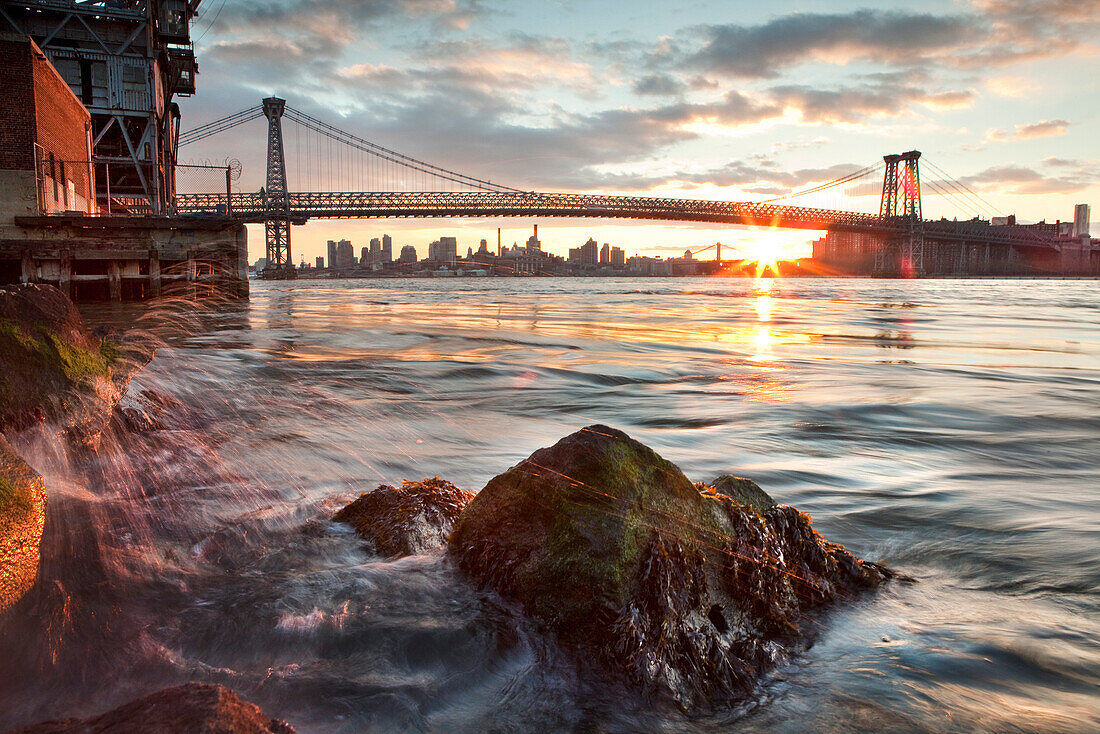 USA, Brooklyn, View of the Williamsburg Bridge and the East River at Sunset from Brooklyn