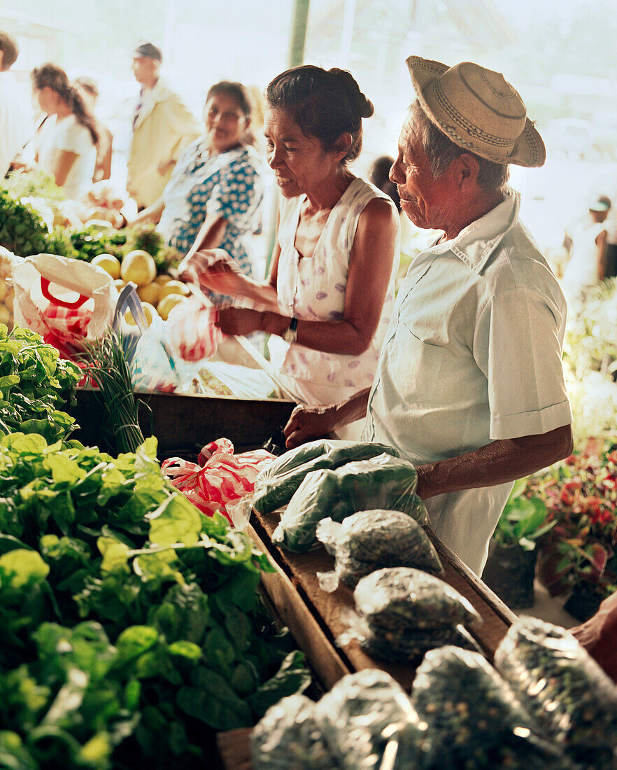 PANAMA, El Valle, people buy produce at an open air farmers market, Central America