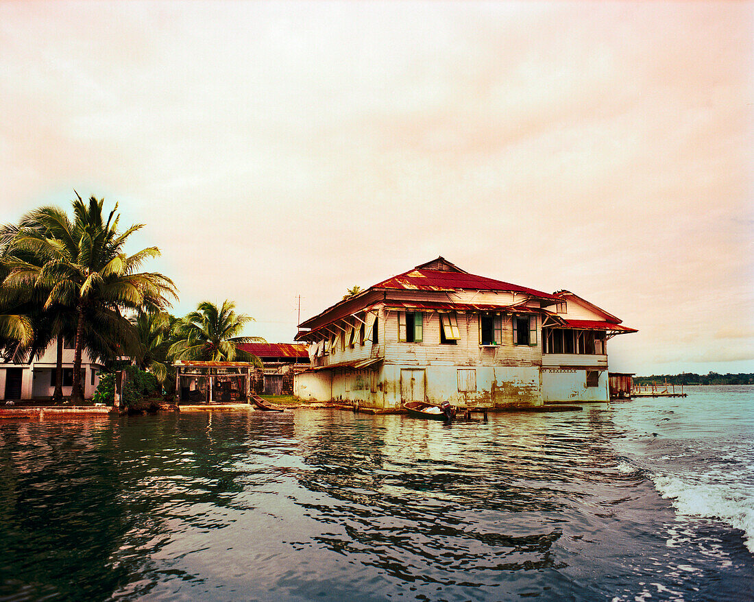 PANAMA, Bocas del Toro, homes by the water on Almirante Bay, Central America
