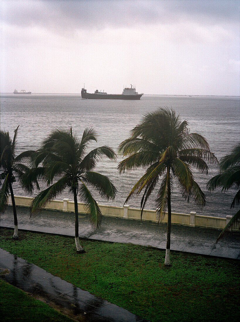 PANAMA, Colon, a container ship waits to pass through the Panama Canal, Central America